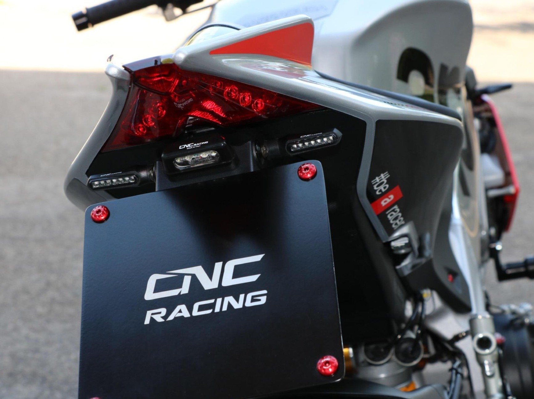 PT103 - CNC RACING Aprilia RSV4 / Tuono V4 (09/20) Adjustable LED License Plate Holder – Accessories in the Motoraider Motorcycle Aftermarket Accessories and Parts Online Shop